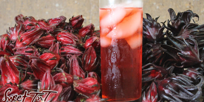 Sorrel juice or roselle drink or juice in glass with ice with red fruit for Christmas season or health benefits for cholesterol, blood pressure, bladder infections, constipation, maylase, use recipe for good taste and health benefits in in Sweet T&T, Sweet TnT, Trinidad and Tobago, Trini, Sorrel Chicken
