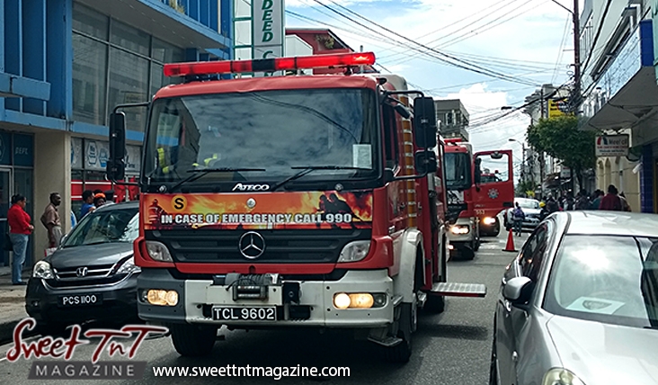 Fire trucks on Henry Street, Port of Spain in sweet T&T for Sweet TnT Magazine, Culturama Publishing Company, for news in Trinidad, in Port of Spain, Trinidad and Tobago, with positive how to photography.