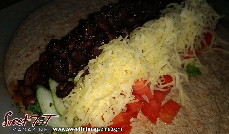 Veggie wraps black beans grated cheese cucumber lettuce tomatoes in sweet T&T for Sweet TnT Magazine, Culturama Publishing Company, for news in Trinidad, in Port of Spain, Trinidad and Tobago, with positive how to photography.