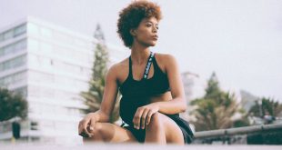 Get in shape with adidas, woman in black tank top sitting