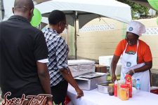Customers eagerly line up to purchase Pigeon Peas pelau. Pigeon Peas Festival