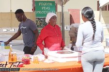 A customer purchases muffins made with Pigeon Peas flour. Pigeon Peas Festival
